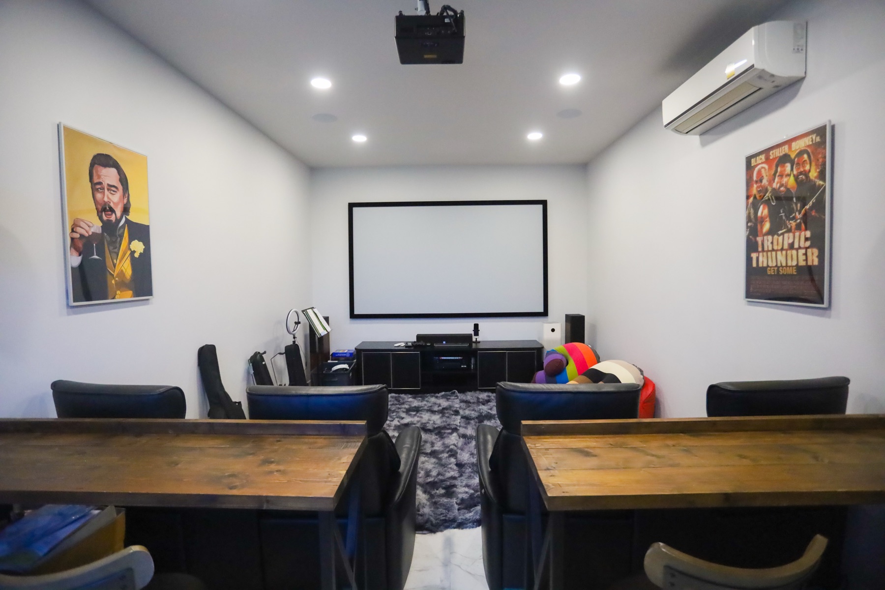 Private cinema room with tiered seating for eight